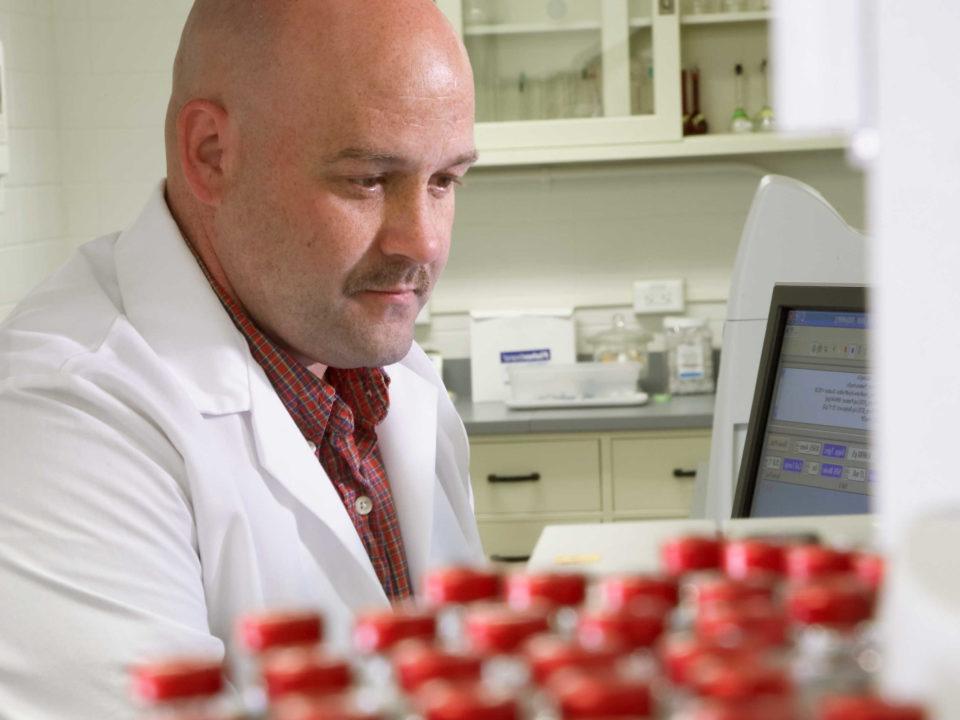 Scientist looking at a computer screen